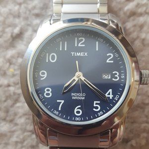 New Timex watch with Indiglo, silver hands, elastic metal band; needs battery